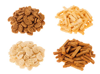 Croutons collection - wheat, rye sliced bread in heaps isolated on white background. Fast food template for menu, advertising, cover.