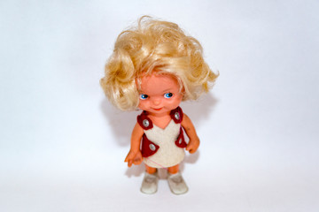 Toy doll made of fabric and safe plastic for children's games
