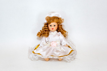 Toy doll made of fabric and safe plastic for children's games
