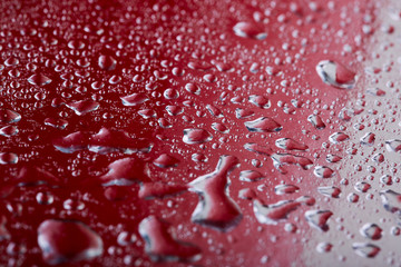 Colored water droplets on a gold background. Abstract liquid sprays