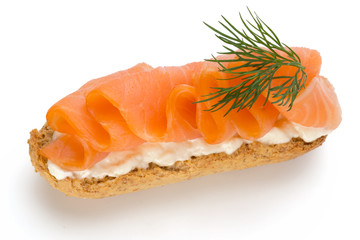 Bread with fresh salmon fillet isolated on white background, top view.