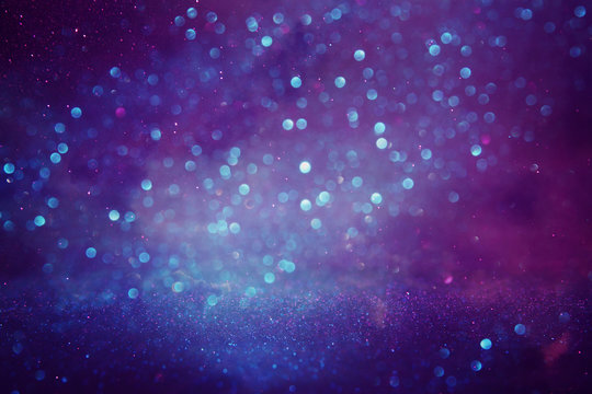 glitter vintage lights background. purple, blue and pink. de focused. © tomertu