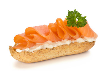 Bread with fresh salmon fillet isolated on white background, top view.