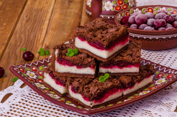 Chocolate cake with cottage cheese and cherry