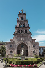 Fototapeta na wymiar Church of the Assumption and statue of Don Pelayo in Cangas de Onis, Asturias, Spain