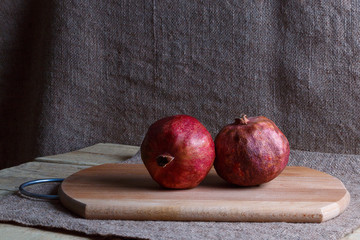 Two grenades on a wooden Board