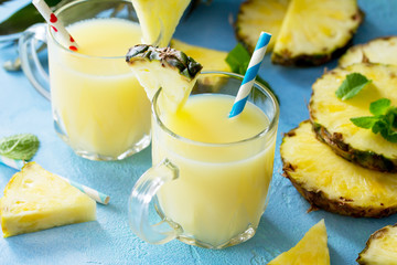 Homemade refreshing fruit beverage with pineapple, fresh vitamins. Cold summer drink.