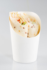 Healthy lunch snack. Tortilla wraps with grilled chicken fillet and fresh vegetables