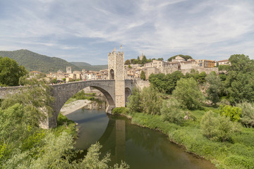 Besalu,Catalonia,Spain. Medieval bridge, romanesque style. Village view.