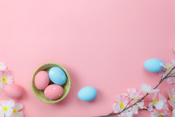 Top view shot of arrangement decoration Happy Easter holiday background concept.Flat lay colorful bunny eggs with accessory ornament floral on modern beautiful pink paper at office desk.pastel tone.