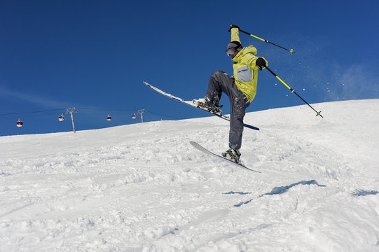 Amazing jump of skier on the mountain slope in Gudauri, Georgia