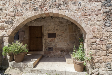 Fototapeta premium Detail facade house,typical and ancient medieval village in Garrotxa region,Santa Pau,Catalonia,Spain.