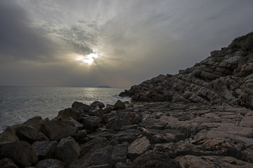 Volcanic rock with sea and sunset