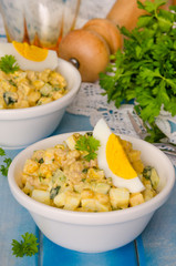Salad with liver of cod, eggs, cucumbers and corn
