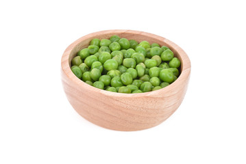 Green peas in wooden bowl isolated