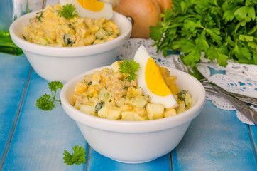 Salad with liver of cod, eggs, cucumbers and corn