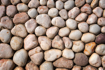 Naturally polished rock pebbles background