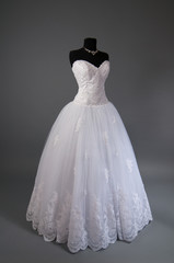 Fototapeta na wymiar White Wedding dress on a mannequin