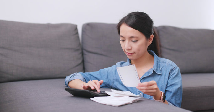 Woman calculate the use of daily life at home