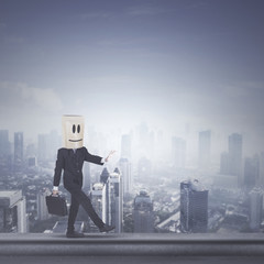 Unknown male manager walking on the rooftop