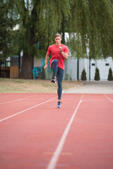 Portrait of Sporty Man on Running Track