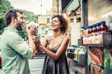 Couple at kiosk in New York