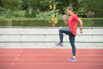 Young Man Is Jogging on Sunny Day