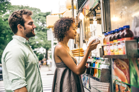 Couple at kiosk in New York