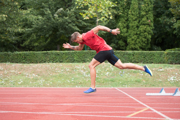 Portrait of Sporty Man on Running Track