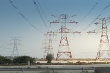 High voltage towers with sky background
