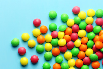 Colorful sweet candies on a blue background