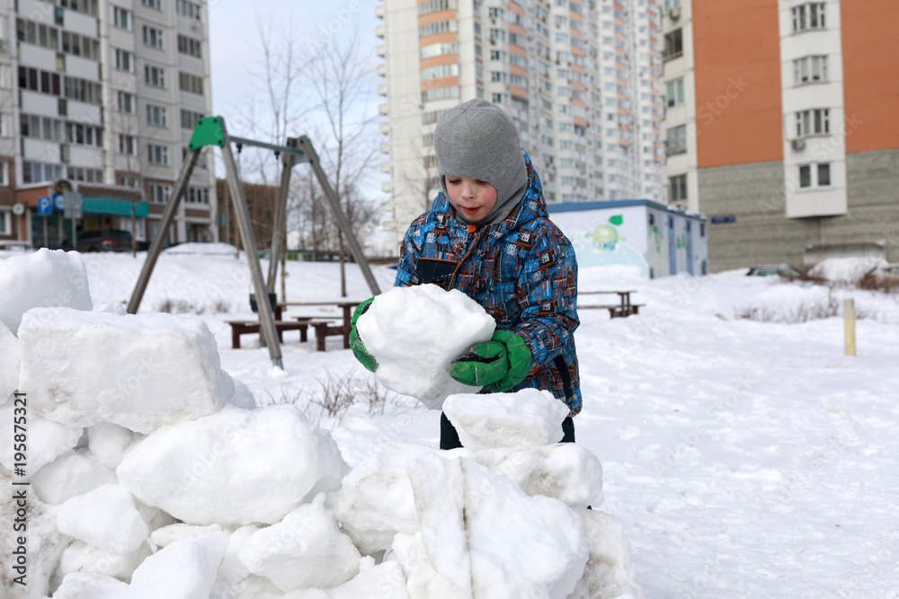 Poster Child building snow fortress