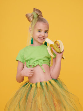 A little girl dressed in a mango flower costume. Stock Photo | Adobe Stock