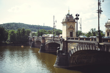 an old historic bridge across the river automobile. Prague, Czech Republic
