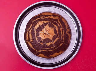 beautiful pie lies on the tray. spiderweb. delicious.