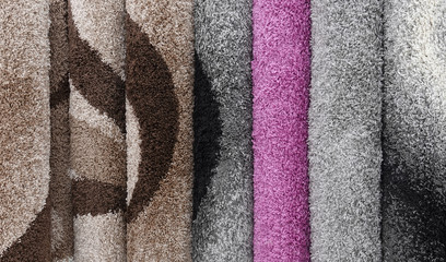 Carpets variety selection rolled up rugs shop store lot