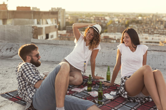 Friends chilling out on a building rooftop