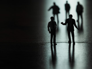 Fototapeta na wymiar Miniature businessman silhouette, business and technology concept.