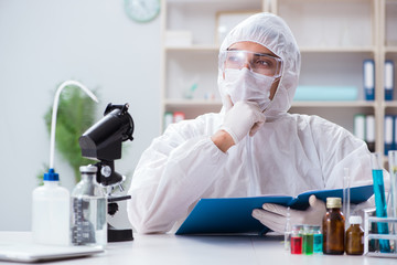 Biotechnology scientist chemist working in lab