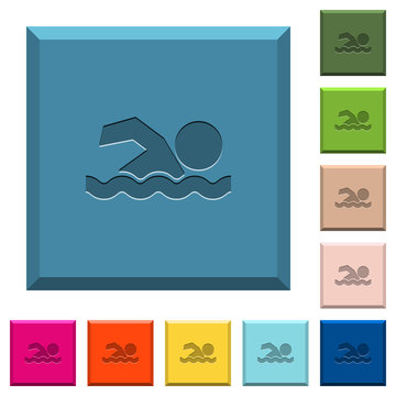 Swimming man engraved icons on edged square buttons