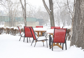 Bar tables covered by snow