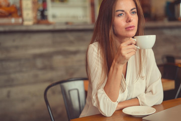 Young girl with a cup of coffee