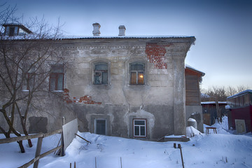 Old houses in ancient Russian city of Kolomna, Moscow region, Russia, after snowfall. Winter overcast day.