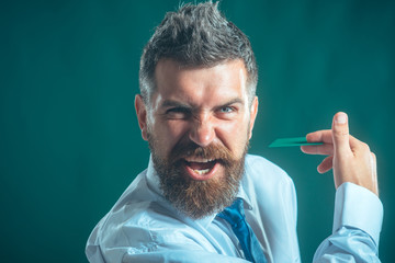 Bank card, creditcard, cash card, business-card - cashless calculation. Business man handing credit card over green background. Entrepreneur man with credit card. Copy space for advertising bank.