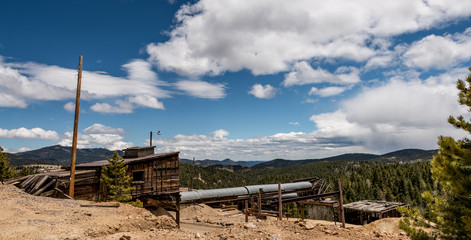 Old mining tools in central Colorado with clouds in the sky