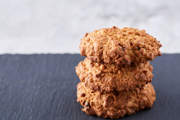 Sweet biscuits arranged in pattern on light textured background, close-up, shallow depth of field, selective focus.