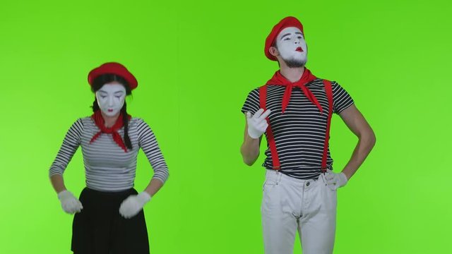 Mimes actors on green background