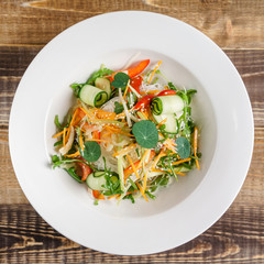 spring salad on the wooden background