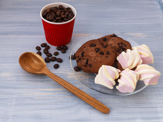 Chocolate cookies sticks with marshmallows on blue background