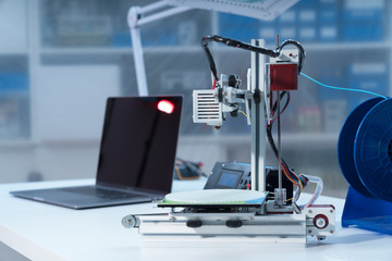 3D printer and computer on the table